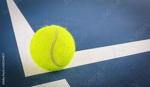 Close-up shots of tennis balls on a blue background field © Ping198
