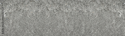 Old rocky concrete wall wide texture. Rough gray cement surface widescreen backdrop. Large abstract background