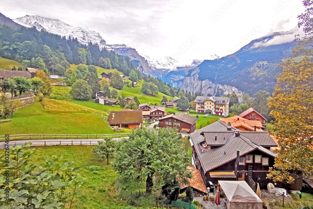Countryside house, farm, mountain, green field, footpath in Switzerland