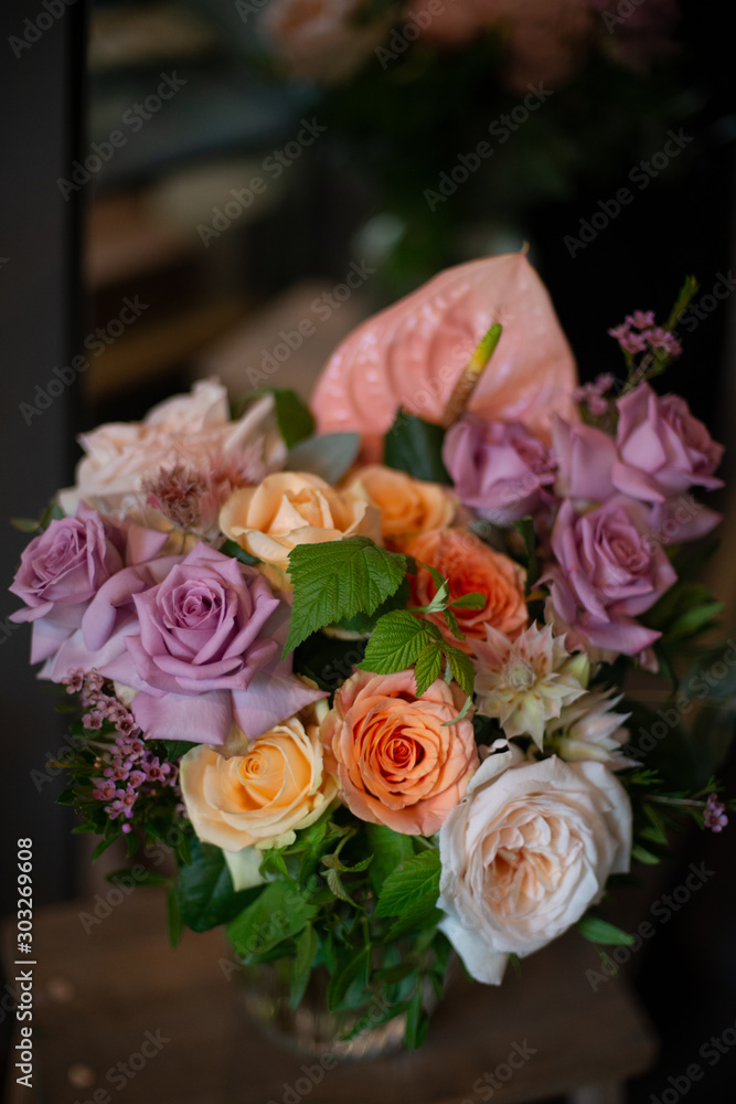 bouquet of flowers. Bouquet of natural fresh roses, tulips, anemones, peonies, ranunculi, matthiola, daffodil, cloves, eucalyptus. A bouquet of flowers is decorated in a composition of flowers 