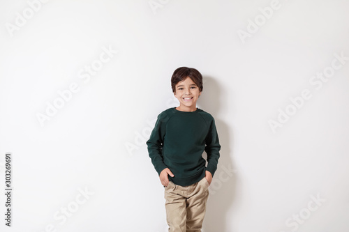 Cute little boy on light ba...