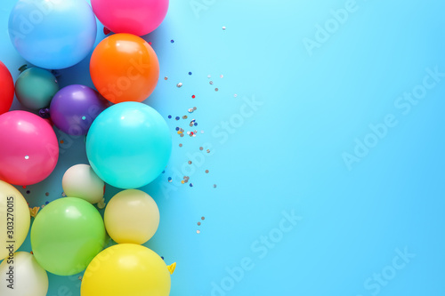 Many balloons on color background photo