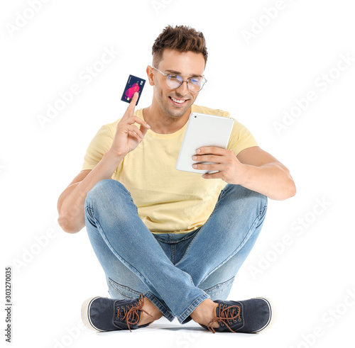Young man with credit card ...