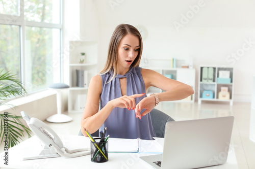 Young woman trying to meet deadline in office