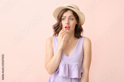 Surprised young woman on co...