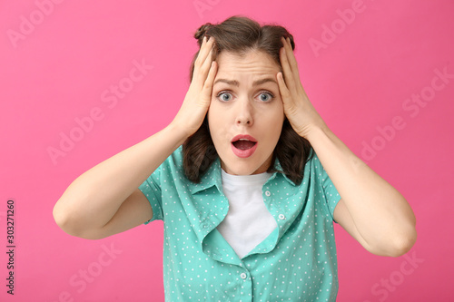 Surprised young woman on co...