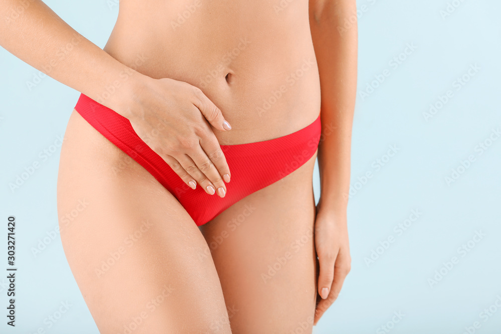 Young woman on color background, closeup. Gynecology concept