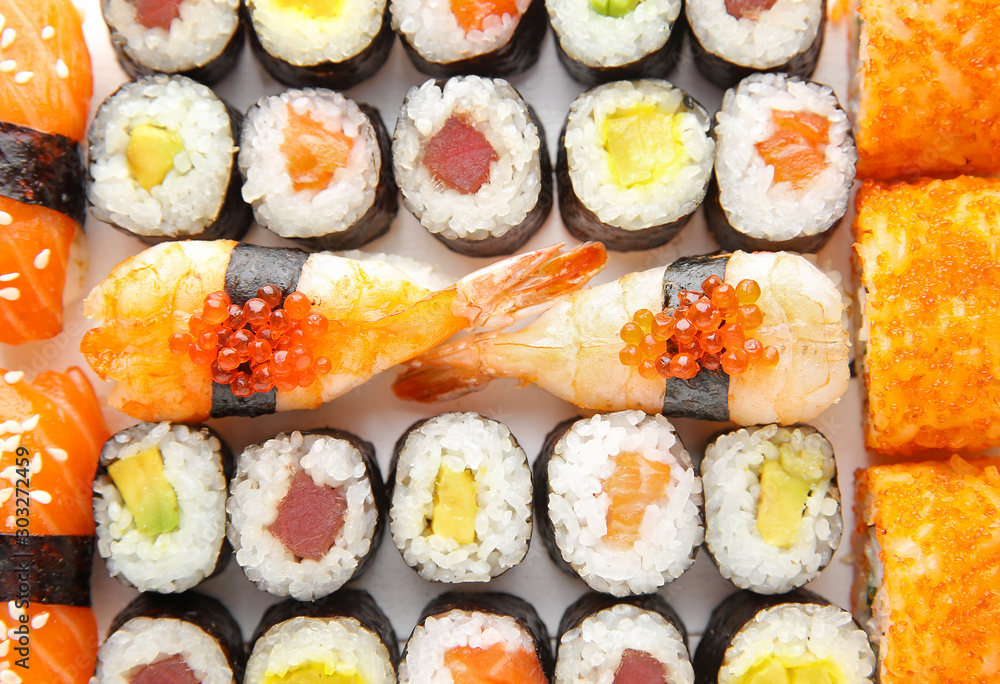 Many tasty sushi as background