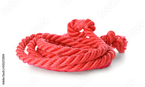 Coiled red rope with knots,...