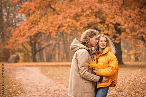 Young couple embracing in a...
