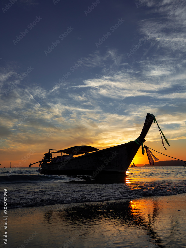 Traditional long-tail boat on the beach in Thailand