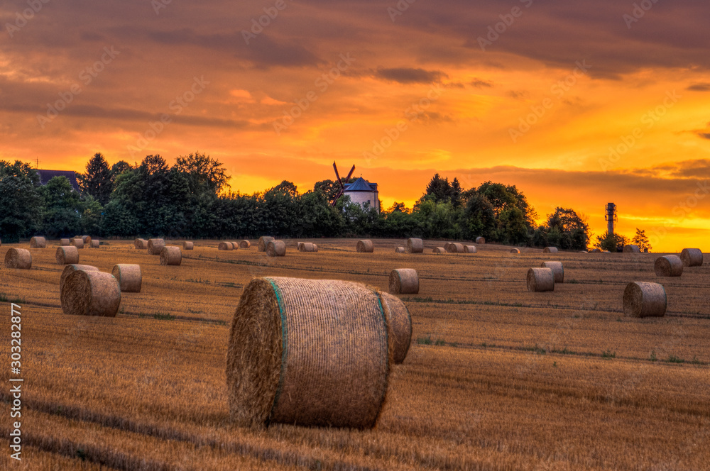 Sunset at harvest time at windmill Syrau