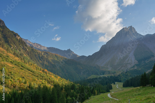 Fantastic trekking of the beautiful French Alps with majestic peaks of rocky mountains.