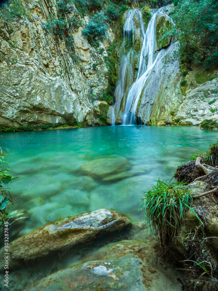 Naklejka premium Waterfall green forest river stream