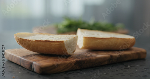 toasted ciabatta bread on olive board