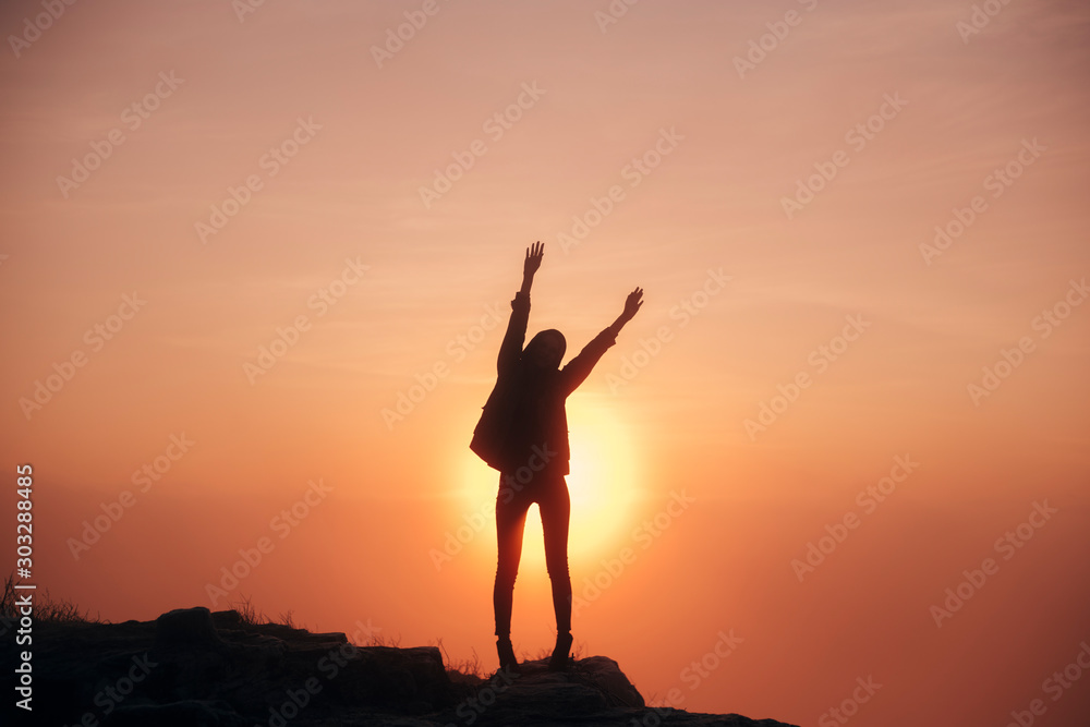 silhouette of a man in the mountains at sunrise, fitness