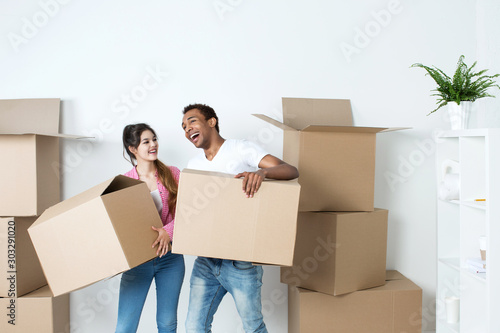 Couple with boxes boxes In new home.
