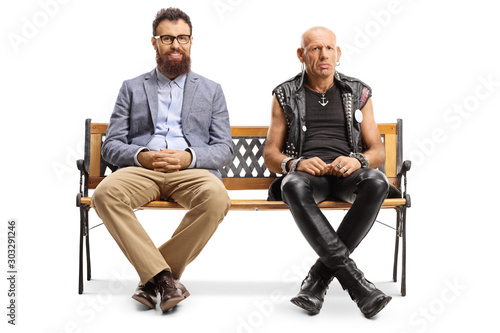 Smiling bearded man and a grumpy punker sitting on a bench