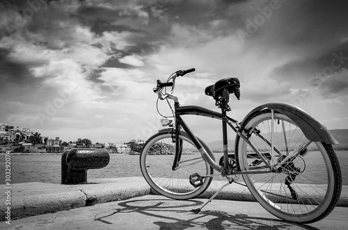Vintage style bicycle standing on Pier of marina Zeas, Piraeus Greece ,