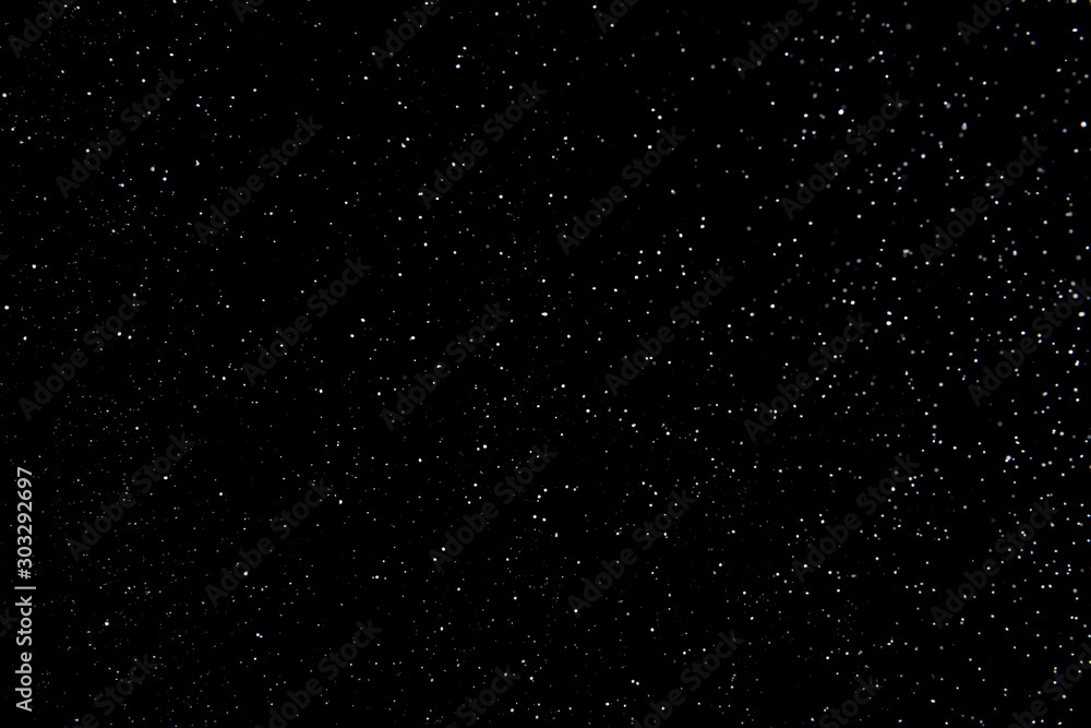 Realistic falling snowflakes. Isolated on black background. Realistic falling snowflakes. Isolated on black background.