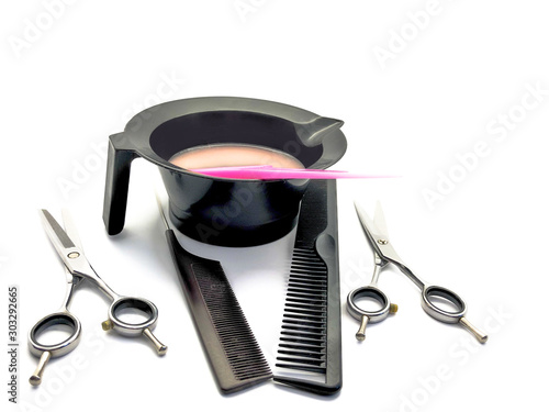 Bowl for paint, comb, pink brush and scissors isolated on a white background. Set of professional hairdressing tools for hair coloring. Composition of tools for a beauty salon.