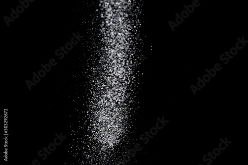 Realistic falling snowflakes. Isolated on black background.