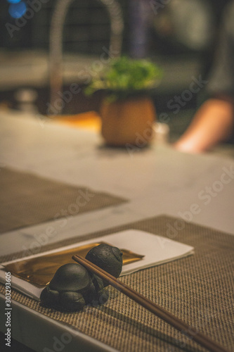 a pair of chopsticks on a table in a restaurant