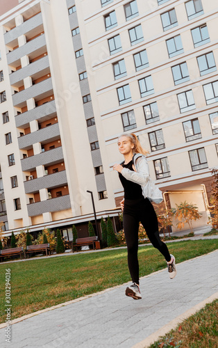 beautiful blonde girl went for a run. Workout outside. Good mood and fresh air © High Stock