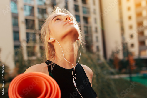 beautiful blonde girl went for a run. Workout outside. Good mood and fresh air