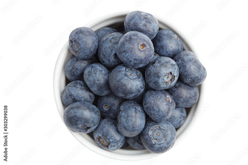 Blueberries in the white ceamic bowl isolated on white. Top view. Blueberries in the white ceamic bowl isolated on white. Top view.