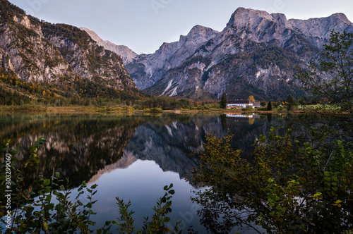 Autumn evening Alps mountain lake with clear transparent water and reflections. Almsee lake  Upper Austria.