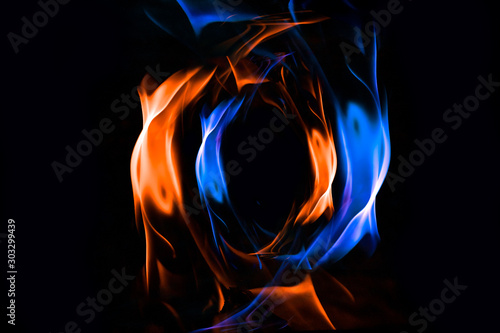 Red and blue fire ring on balck background © lukjonis