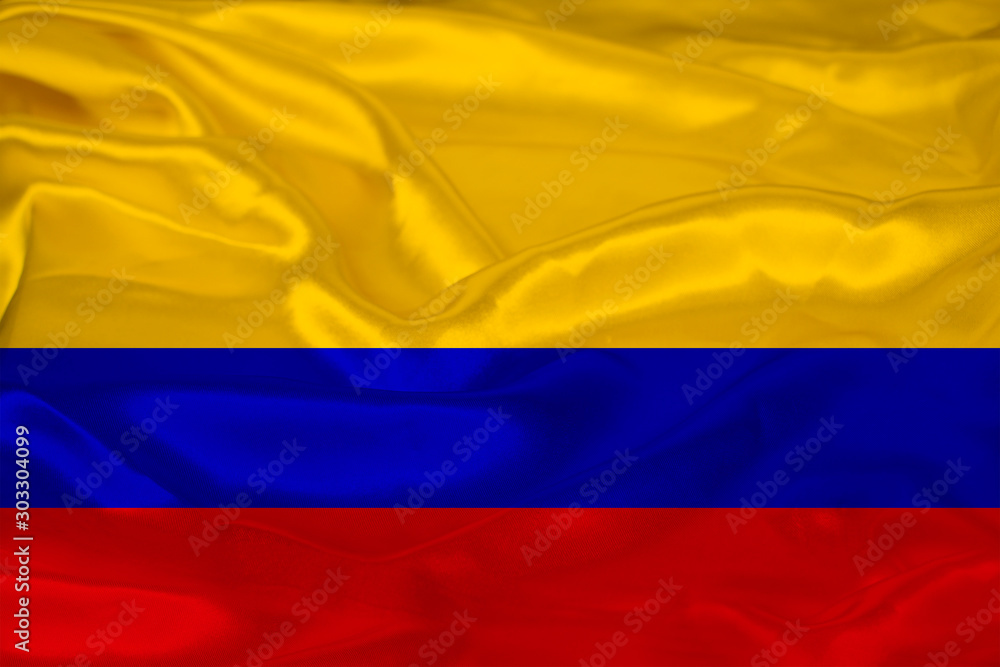 beautiful photo of the colored national flag of the modern state of Colombia on a textured fabric, concept of tourism, emigration, economics and politics, closeup beautiful photo of the colored national flag of the modern state of Colombia on a textured fabric, concept of tourism, emigration, economics and politics, closeup