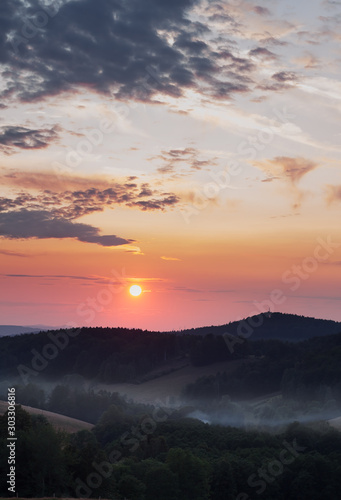 L  zn   Libverda  CZECH REPUBLIC - JULY  17 2019  Sunset in the mountains. Fog in the forest