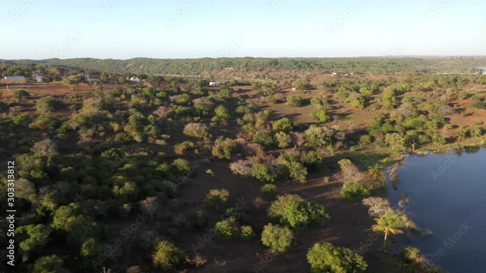 Lateral Flight Over Inhampavala Lake And Tribal Village in Chindeguele Mozambique Lateral Flight Over Inhampavala Lake And Tribal Village in Chindeguele Mozambique