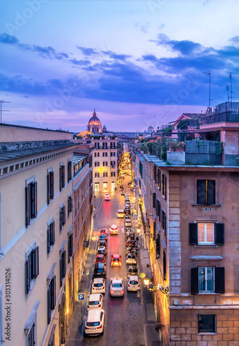 Quadro su tela Aerial View of Rush Hour Street at Magenta Dusk in Rome, Italy