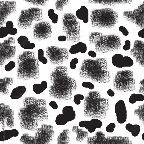 Seamless abstract pattern. Black isolated spots of different shapes, sizes and textures on a white background. Elements are randomly scattered.