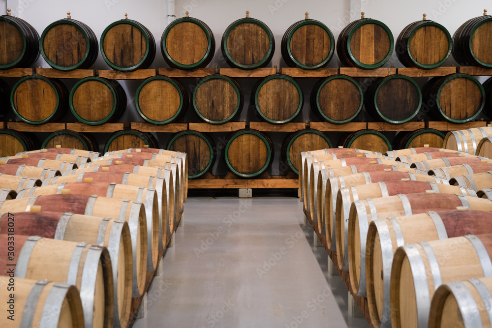 Wooden wine barrels for storage in wine cellar