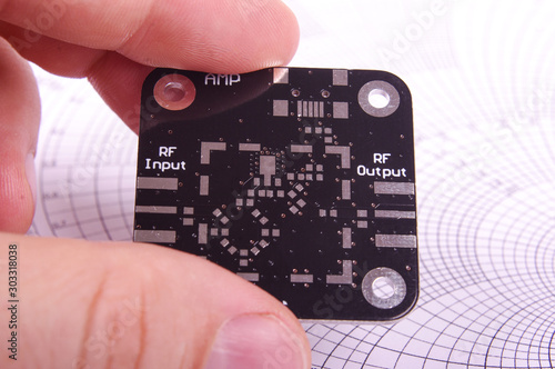 Plakat RF engineer holding empty black PCB board