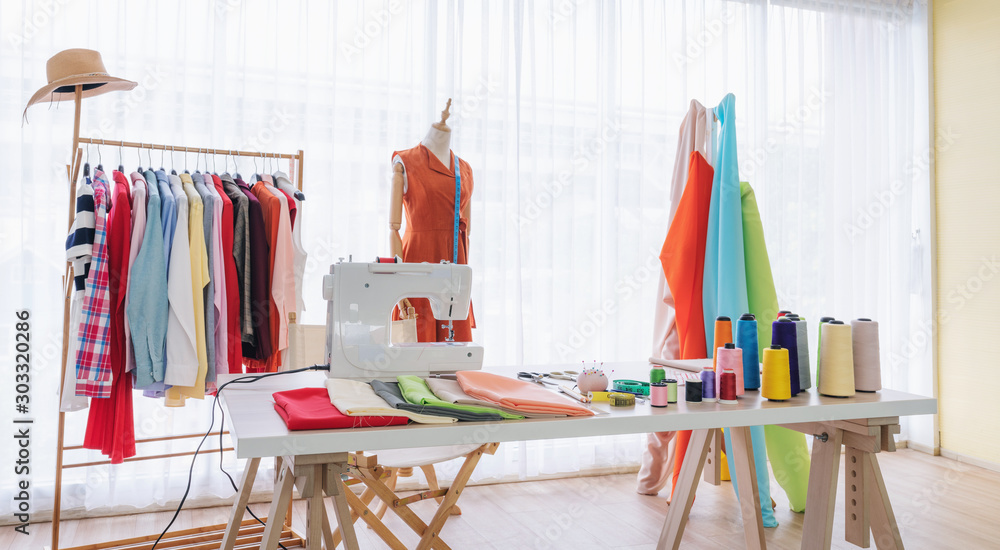 Fashion designer working studio, with sewing items and materials on working table