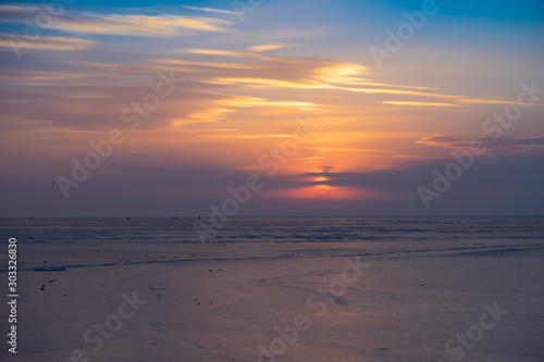 Sunset over the frozen surface of the Amur Bay. © vvicca