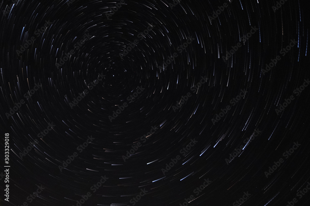 Long exposure starry sky, twisted tracks of stars. Long exposure starry sky, twisted tracks of stars.