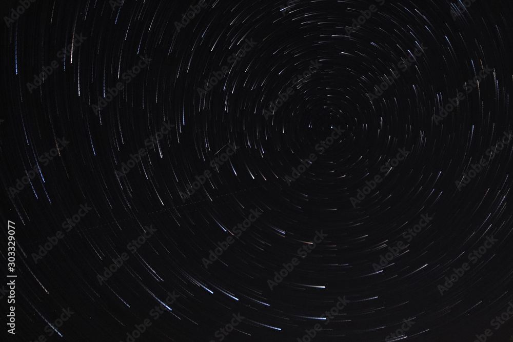 Long exposure starry sky, twisted tracks of stars. Long exposure starry sky, twisted tracks of stars.