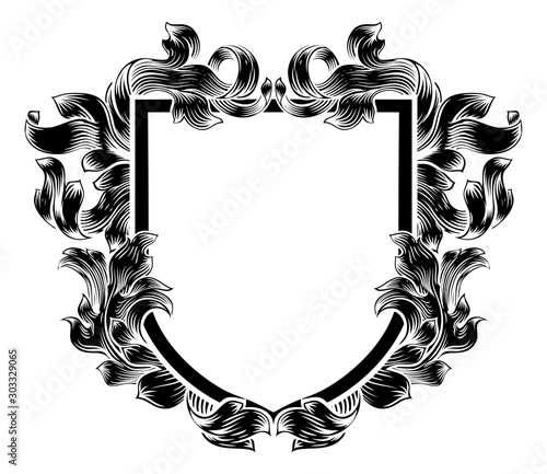 A coat of arms crest heraldic medieval knight or royal family shield. Vintage motif with filigree leaf heraldry.