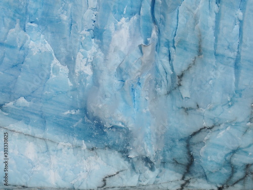 The moment glaciers collapse due to climate change, Close-up on a clear blue glacier, Perito Moreno Glacier, El Calafate, Los Glaciares National Park near El Chalten, Patagonia, Argentina
