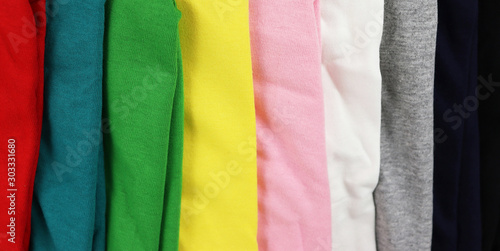Fototapeta Naklejka Na Ścianę i Meble -  stack of colorful t-shirts on white