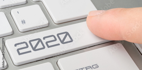 A keyboard with a labeled button - 2020