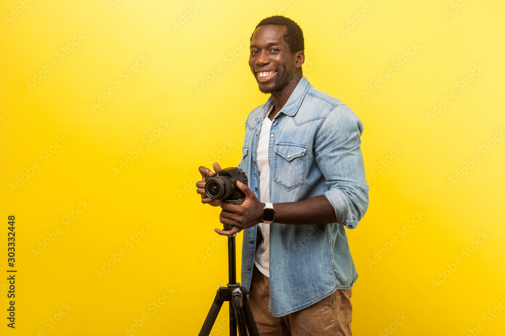 Man Holding Black DSLR Camera · Free Stock Photo