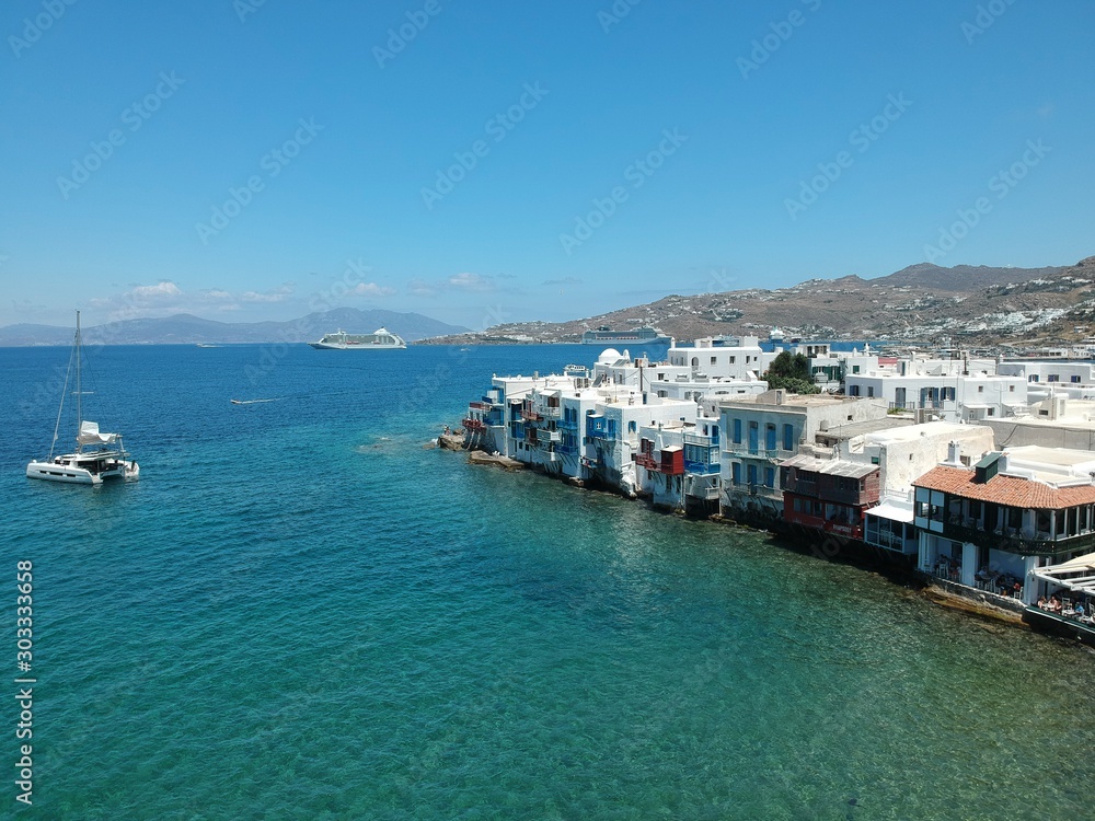 MYKONOS, GREECE : aerial view on the village and port side at good weather