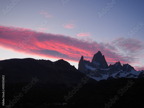 Ealry morning view of the Mount Fitz Roy and clouds turning red, Los Glaciares National Park near El Chalten, Patagonia, Argentina photo